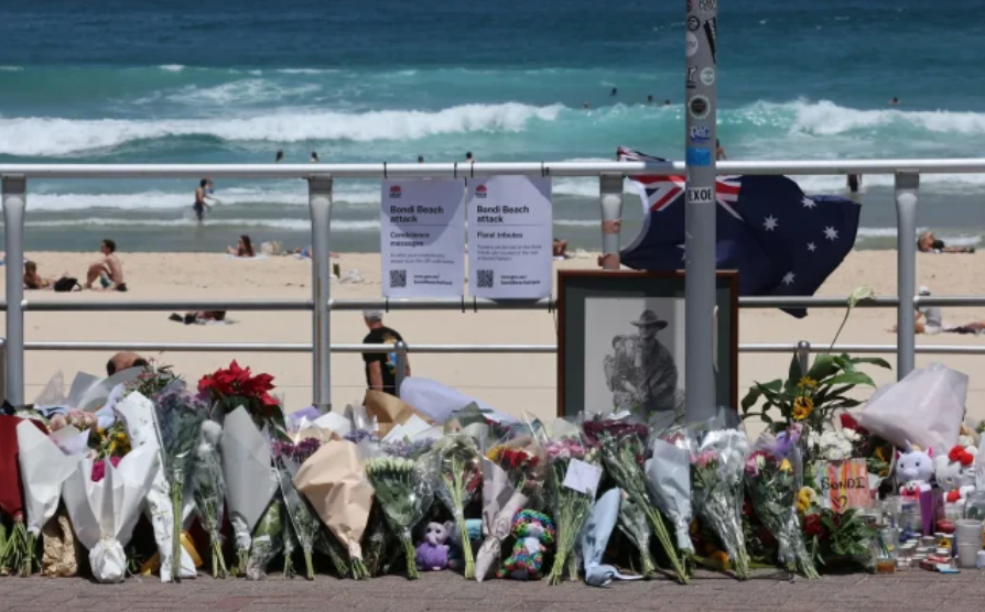Floral tributes left by mourners at the promenade of Bondi Beach in Sydney